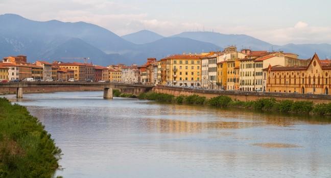 River Arno floating through the medieval city of Pisa.; 