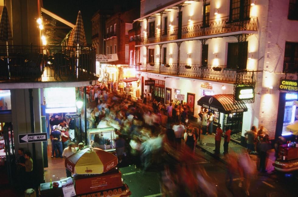 Crowded street at night in the French Quarter of New Orleans, LA.