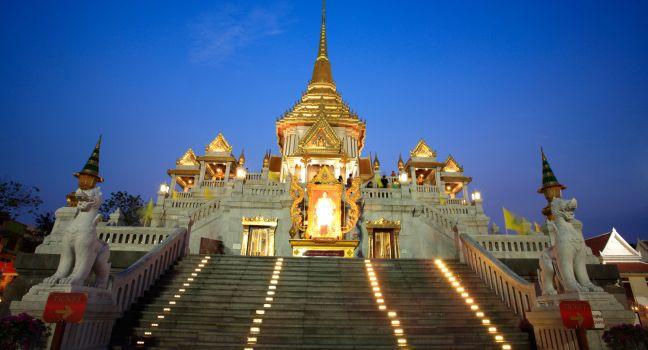 Wat Traimit entrance at dusk in Bangkok, Thailand.  Traimit temple, located near China town, is built in 1832 by three Chinese donors.; 