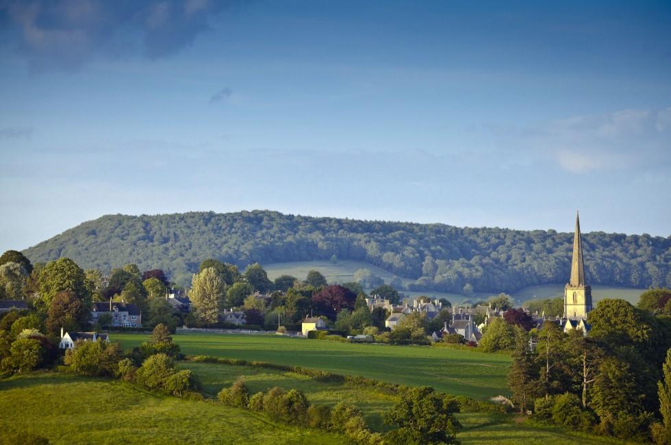 Idyllic rural view of gently rolling patchwork farmland and villages with pretty wooded boundaries, in the beautiful surroundings of the Cotswolds, England, UK.