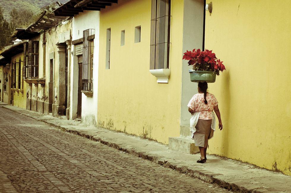 Woman, cobble streets Antigua Guatemala. 