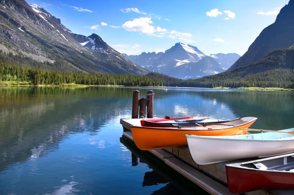 Canoes by lake Mc Donald in Glacier national park.