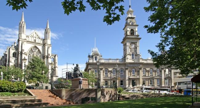 The Octagon, center of Dunedin, New Zealand, with St. Paul's Cathedral to the left and Municipal Chambers more to the right; 
