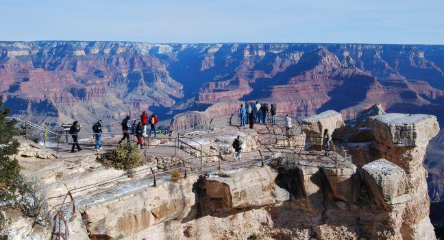 Tourists at the Grand Canyon taken from Grandview Point overlook South rim.