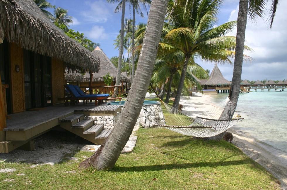 Famous travel destination Lagoon Rangiroa with bungalows. French Polynesia.
