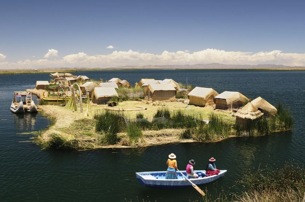 Peru, floating Uros islands on the Titicaca lake, the largest highaltitude lake in the world (3808m). Theyre built using the buoyant totora reeds that grow abundantly in the shallows of the lake.; 
