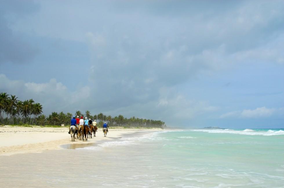 People were on horseback by the beautiful Macao beach in Punta Cana, Dominican Republic