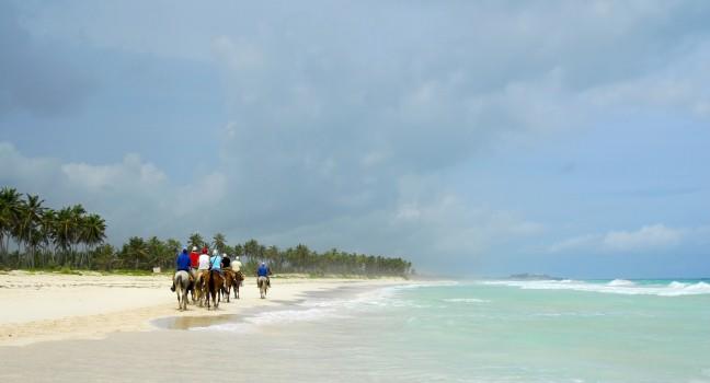 People were on horseback by the beautiful Macao beach in Punta Cana, Dominican Republic