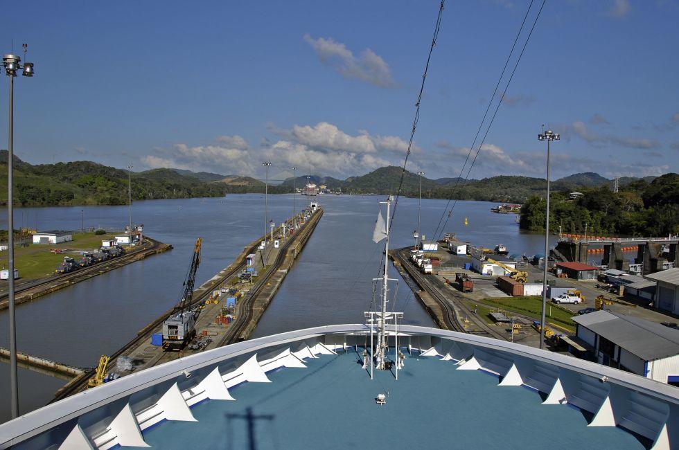 Cruise ship passing through locks in the Panama Canal, a major waterway linking the Atlantic and Pacific oceans.