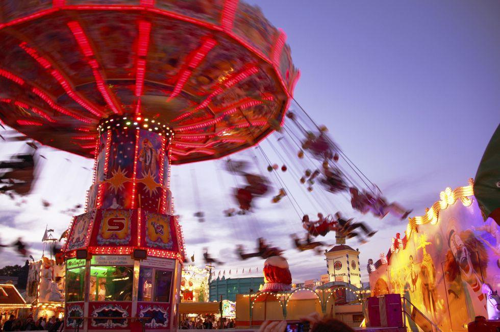 MUNICH - OCTOBER 4: An illuminated chairoplane is attracting visitors at the Oktoberfest fair ground in Munich on October 4, 2010 in Munich, Germany.; Shutterstock ID 128113910; Project/Title: AARP; Downloader: Melanie Marin