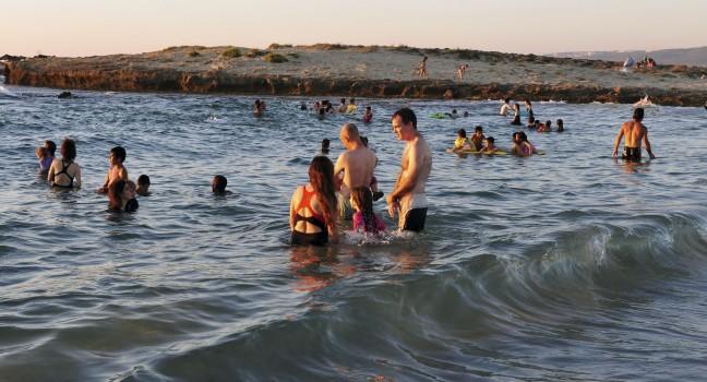 ZICHRON YAAKOV, ISR - AUG 07: Visitors at sanctuary Dor Habonim beach on Au 07 2009. It's one of the top 10 most beautiful beaches in Israel!