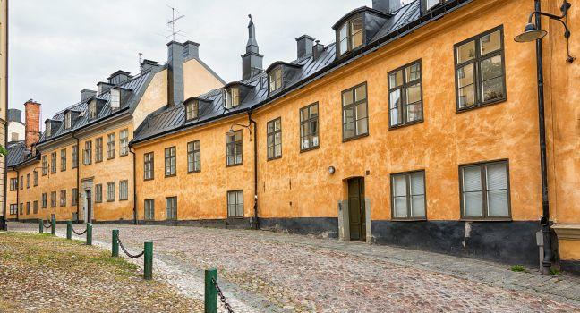 Old architecture on cobblestone street in Stockholm Sodermalm area.