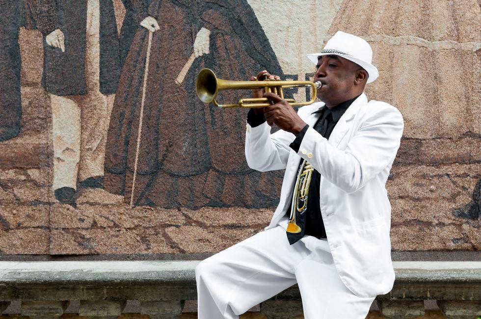 HAVANA, CUBA - JANUARY 8, 2015 : Black cuban musician playing the trumpet; Shutterstock ID 243852667; Project/Title: Fodor's Cuba; Downloader: Fodor's Travel